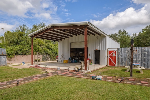 view of outbuilding with a lawn