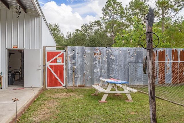 view of outbuilding with a lawn