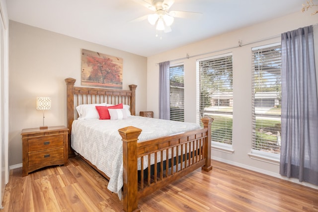 bedroom featuring light wood-type flooring and ceiling fan