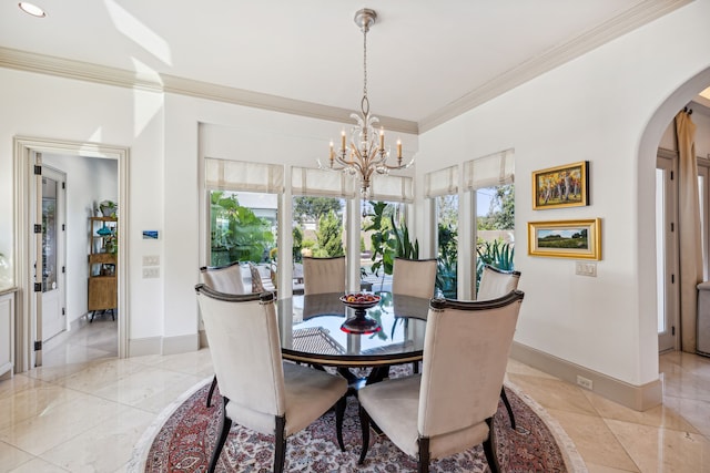 dining space featuring ornamental molding, a chandelier, and a healthy amount of sunlight