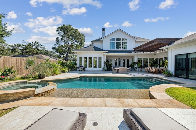 view of pool featuring a patio, an in ground hot tub, and ceiling fan