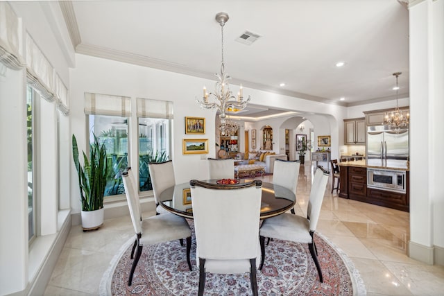 dining area with an inviting chandelier and ornamental molding