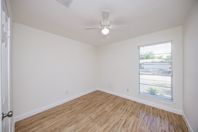 unfurnished room with light hardwood / wood-style flooring and ceiling fan