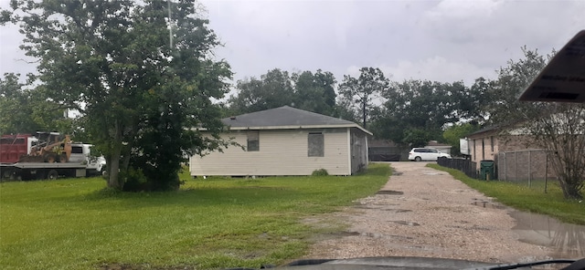 view of side of property featuring a yard