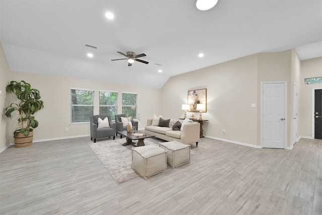 living room featuring light hardwood / wood-style floors, ceiling fan, and vaulted ceiling