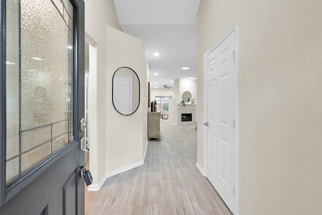 corridor featuring light hardwood / wood-style floors