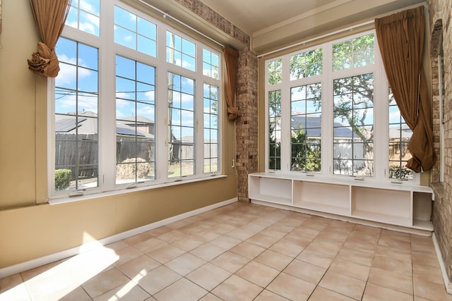 unfurnished sunroom with a healthy amount of sunlight