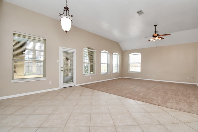 interior space with light carpet, lofted ceiling, and ceiling fan