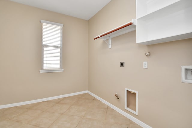 laundry area featuring light tile patterned flooring, electric dryer hookup, gas dryer hookup, and washer hookup