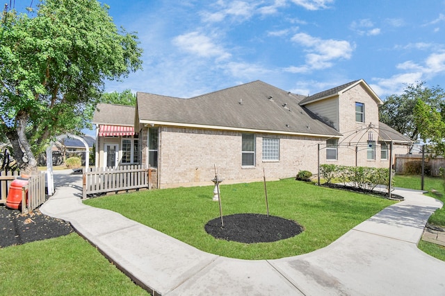 view of side of property featuring a lawn