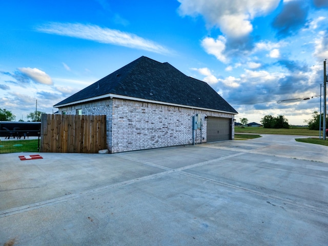 view of property exterior with a garage