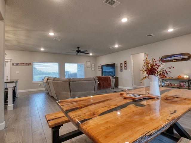 dining area featuring ceiling fan and hardwood / wood-style flooring