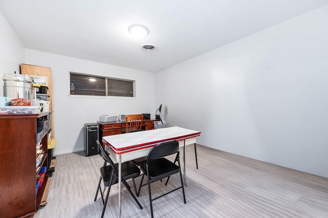 dining area featuring light wood-type flooring