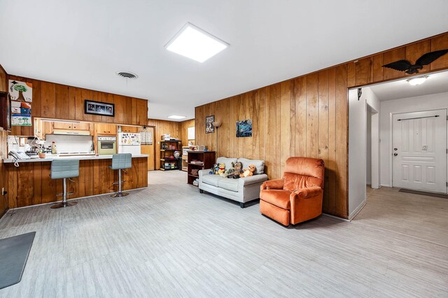 living room with wooden walls