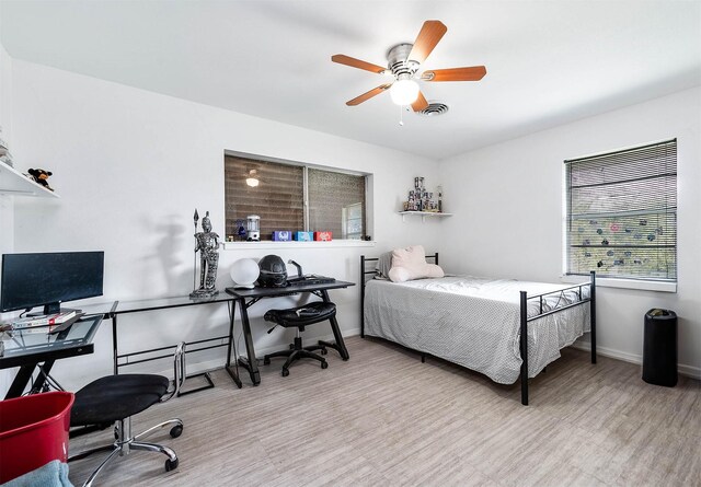 bedroom featuring ceiling fan and light wood-type flooring