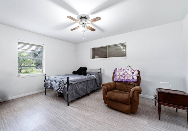 bedroom featuring ceiling fan and light hardwood / wood-style flooring