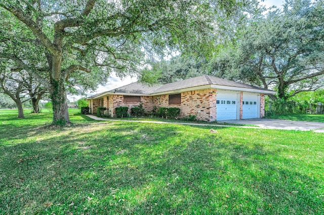 ranch-style home with a garage and a front yard