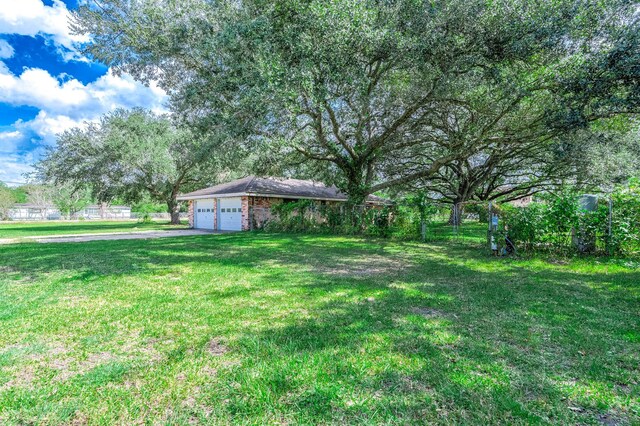 view of yard featuring a garage