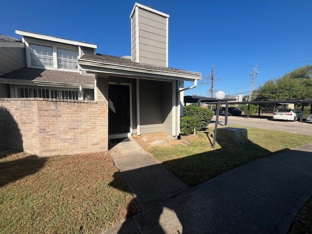 exterior space with a yard