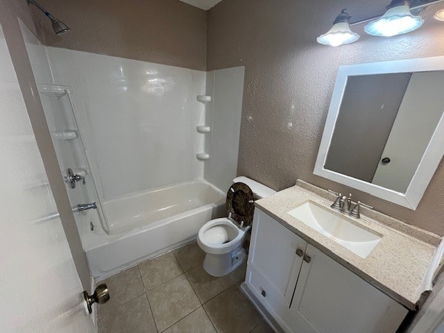 full bathroom featuring vanity, bathing tub / shower combination, toilet, and tile patterned floors