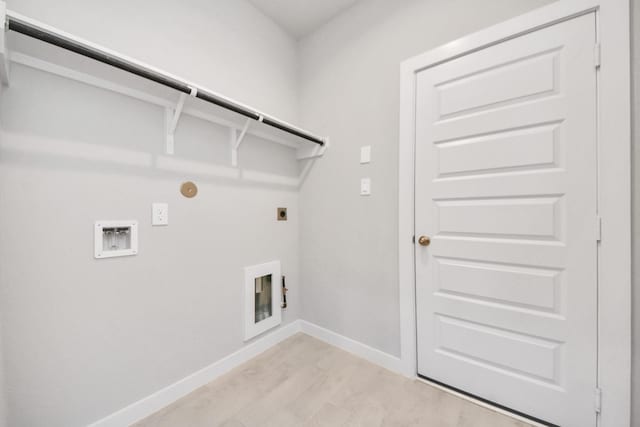 clothes washing area with light hardwood / wood-style floors, washer hookup, and electric dryer hookup