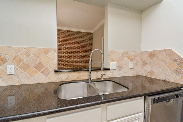 3809 Wakeforest St, Houston, TX 77098 - kitchen with stainless steel dishwasher, ornamental molding, a sink, dark stone counters, and decorative backsplash