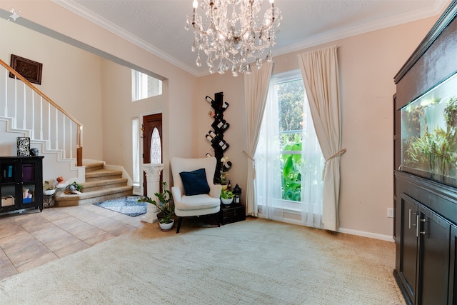 sitting room with an inviting chandelier, a textured ceiling, a towering ceiling, crown molding, and light colored carpet