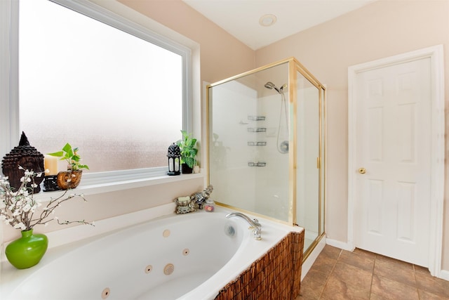 full bathroom with a shower stall and a jetted tub