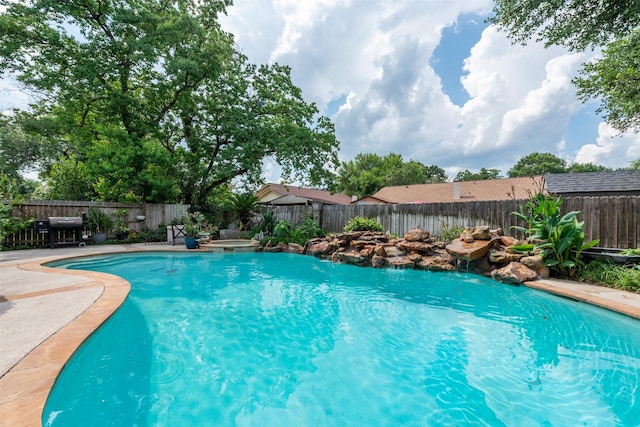 view of pool with a fenced backyard and a fenced in pool
