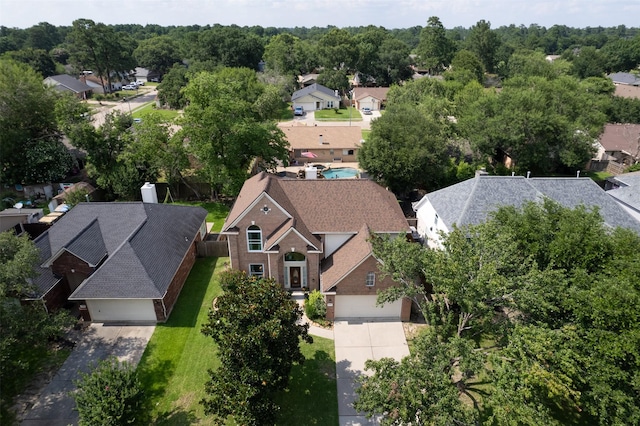 birds eye view of property with a residential view