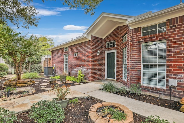 doorway to property featuring central AC