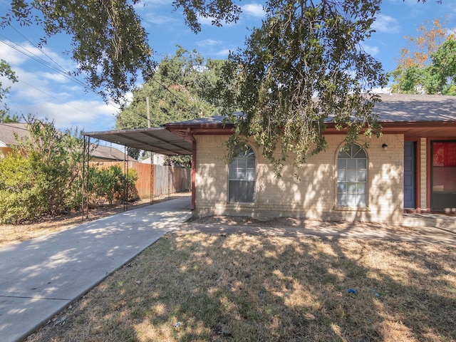 view of front of property featuring a carport