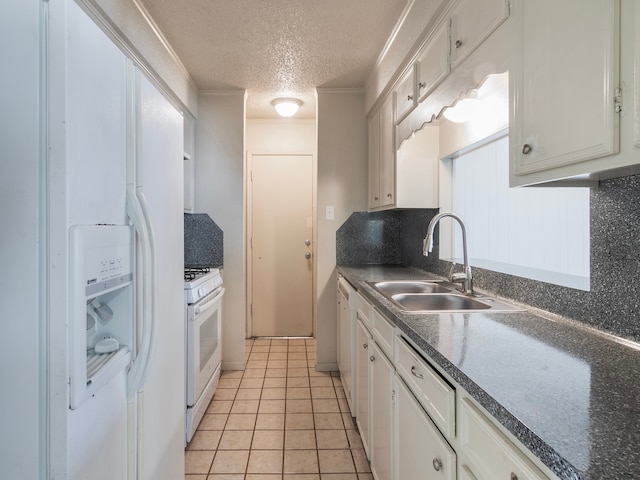 kitchen featuring white appliances, sink, backsplash, a textured ceiling, and white cabinets