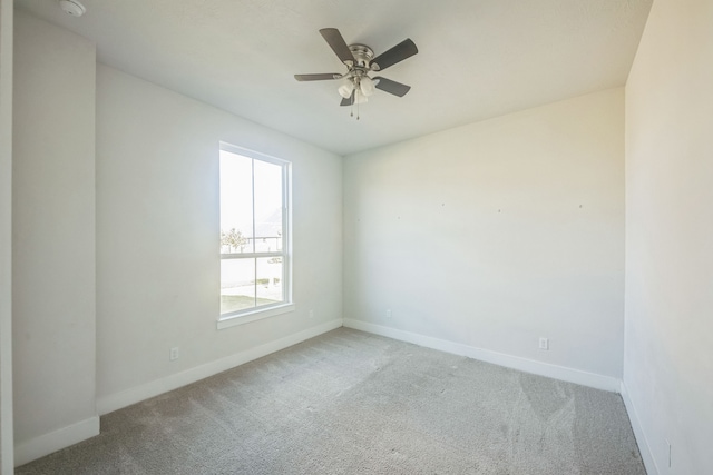 empty room with carpet flooring and ceiling fan