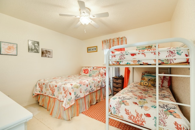 bedroom featuring a textured ceiling and ceiling fan