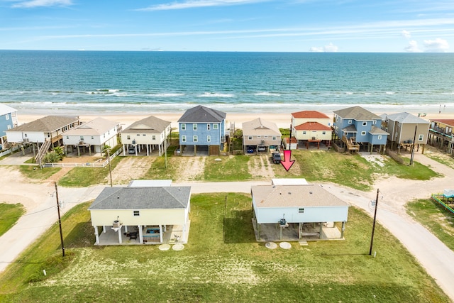 aerial view with a water view and a view of the beach