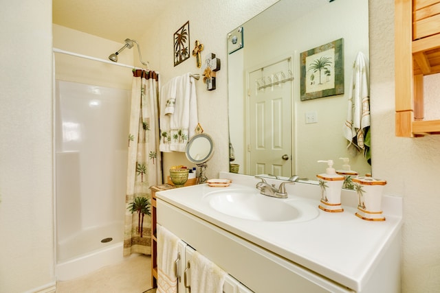 bathroom with vanity and a shower with curtain