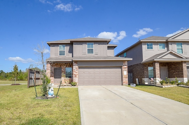 view of front of property with a front yard and a garage