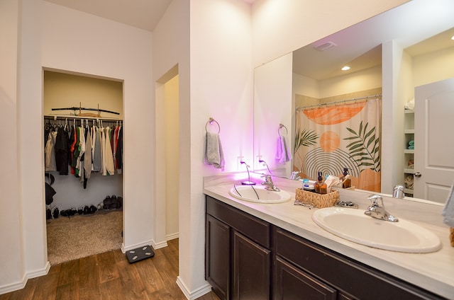 bathroom with vanity and hardwood / wood-style flooring