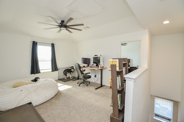 home office featuring light colored carpet and ceiling fan