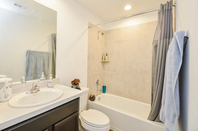 full bathroom with vanity, toilet, and shower / bath combo with shower curtain