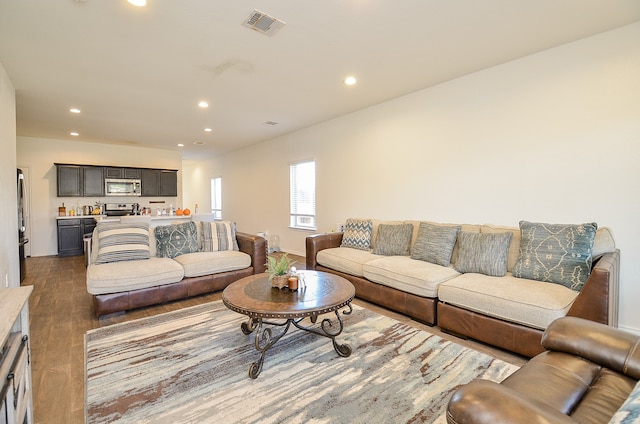 living room with dark hardwood / wood-style flooring