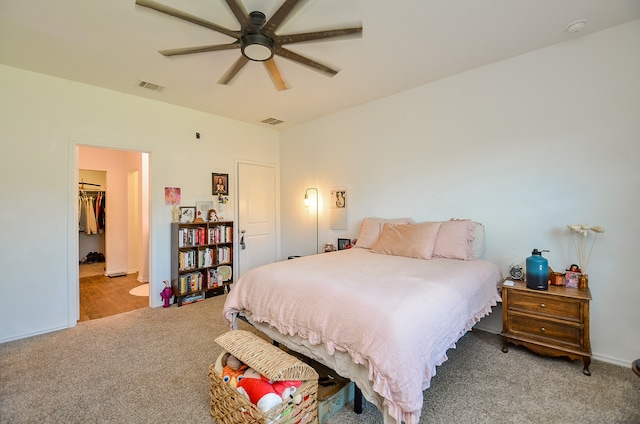 bedroom featuring light colored carpet and ceiling fan