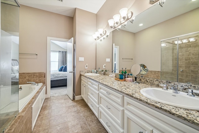 bathroom with tile patterned floors, vanity, and separate shower and tub