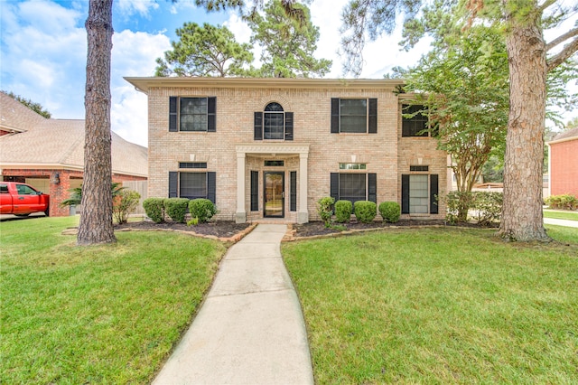 view of front of home with a front lawn