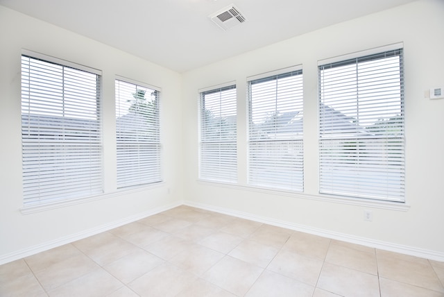 empty room with light tile patterned floors