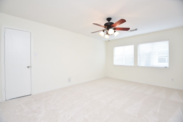 carpeted empty room with ceiling fan