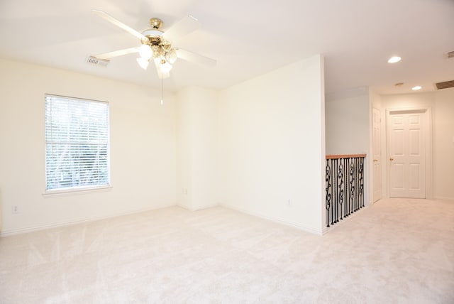 carpeted empty room with ceiling fan