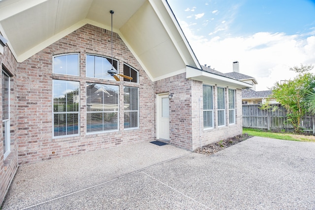 entrance to property featuring a patio