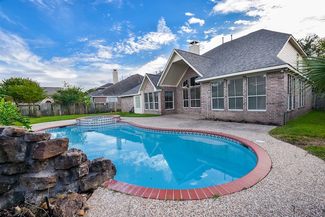 view of swimming pool featuring a patio area